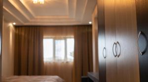 a hotel room with a bed and a window at Hotel Donna Crescenza in Locorotondo