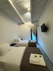 Vie rêvée luxury suites客房内的一张或多张床位