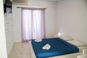 Postel nebo postele na pokoji v ubytování Sunrise Hotel