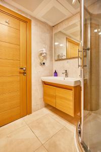 a bathroom with a sink and a shower at Ardey Hotel in Istanbul