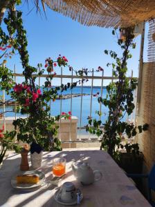 a table with a view of the ocean at La Bella Trani - Suites and B&B in Trani