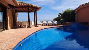 Der Swimmingpool an oder in der Nähe von Villa Puerto Blanco