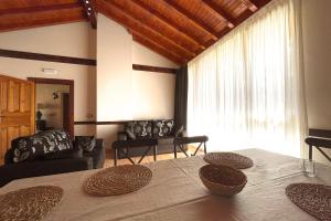 a living room with a table with two baskets on it at Villa Micaela in Lamadrid +7 photos