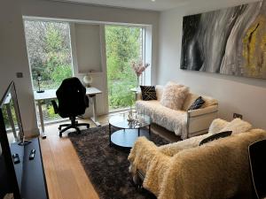 A seating area at Modern house in central London