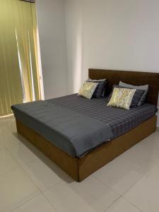 a bed with two pillows on it in a room at R&R residencies in Mount Lavinia