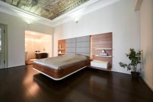 a bedroom with a large bed in a room at Luxury apartment Baron fon Fersen in Tallinn