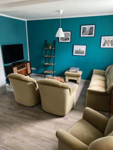 a living room with two couches and a television at City Ferienhaus in Neheim in Arnsberg