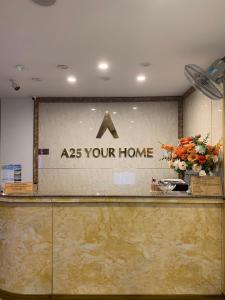 a as your home sign on a counter at A25 Hotel - Đội Cấn 2 in Hanoi