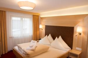 Posteľ alebo postele v izbe v ubytovaní Hotel Albona