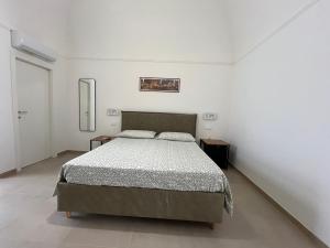 Postel nebo postele na pokoji v ubytování DIMORA LARA