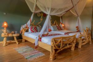 Postelja oz. postelje v sobi nastanitve Embogo Safari Lodges