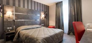 Postel nebo postele na pokoji v ubytování Hostellerie St Vincent