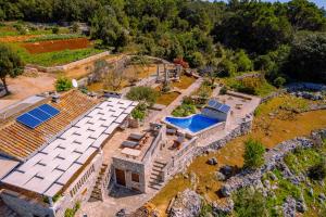 an aerial view of a house with solar panels on the roof at Eco holiday house Cive in Korčula