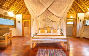 Postelja oz. postelje v sobi nastanitve Embogo Safari Lodges