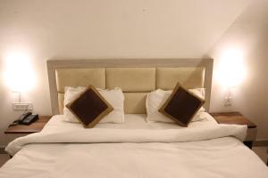 Säng eller sängar i ett rum på Paradise Inn