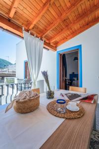 a table with a white table cloth on it at Casa Norma in Lipari