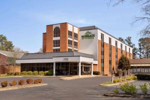 a building with a warehouse sign on top of it at Wingate by Wyndham Williamsburg in Williamsburg