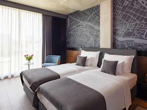 Posteľ alebo postele v izbe v ubytovaní Mövenpick Zagreb