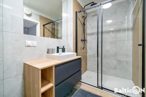 Kúpeľňa v ubytovaní Apartamenty BalticON Kasprowicza parking inclusive + 37 fotografií