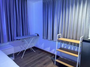Postel nebo postele na pokoji v ubytování Neo Hatyai Hotel