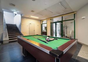 a pool table in the middle of a room at Apartament nad Zalewem in Serock