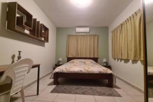 Giường trong phòng chung tại Comfortabele vakantiewoning in Wanica, Suriname +18 ảnh
