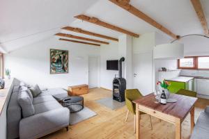 a living room with a couch and a table at Ferienwohnung OberGuess in Leutschach
