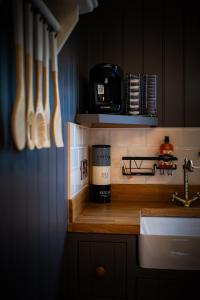 a kitchen with a counter with a coffee maker on it at Cherry Tree Lodge in Limavady