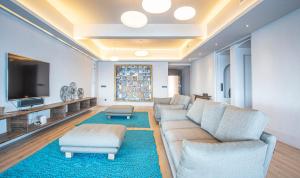 a living room with a couch and a tv at BYPILLOW Cap Sa Sal in Begur +37 photos