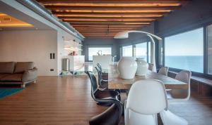 a dining room with a table and chairs at BYPILLOW Cap Sa Sal in Begur
