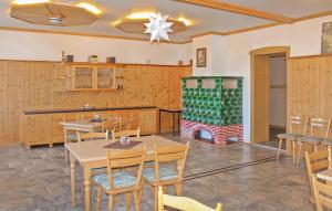 a dining room with a table and a fireplace at Ferienwohnung Neuhausen in Neuhausen +9 photos