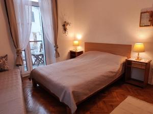 Postel nebo postele na pokoji v ubytování APARTMAN Riva 1