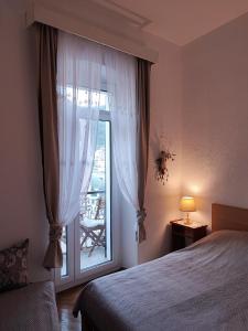 Postel nebo postele na pokoji v ubytování APARTMAN Riva 1