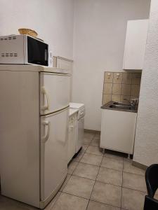 Kuchyň nebo kuchyňský kout v ubytování APARTMAN Riva 1