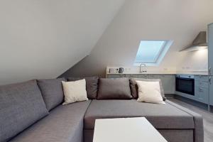 a living room with a couch and a kitchen at LONDON STAY Flats in London +79 photos