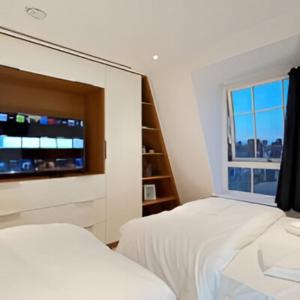Ένα ή περισσότερα κρεβάτια σε δωμάτιο στο Marble Arch Penthouse 2 Bed