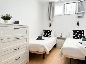 Postel nebo postele na pokoji v ubytování H4U Apartments - Playa & Dunas + 13 fotografií