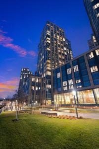 a large building in a city at night at Prime NYC Waterfront Gem in Mott Haven