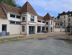 a large building with a lot of windows at Hôtel des arts - Gîte Bande Dessinée dans le Perche - Spa in Rémalard