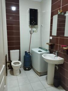 a bathroom with a toilet and a sink at Blue Bay Asia Ain Elsokhna in Ain Sokhna