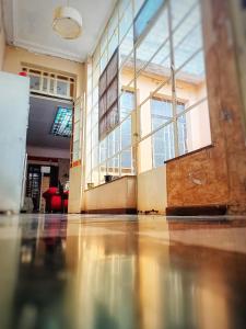 an empty room with a large window in a building at En La Plata Hostel El Pampa in La Plata