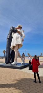 a statue of a man and a woman standing in front of a statue at MD HOUSE 2.0. CIVITAVECCHIA in Civitavecchia