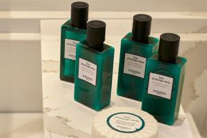 three bottles of soap sitting on a table at Phos The Boutique in Akrotiri