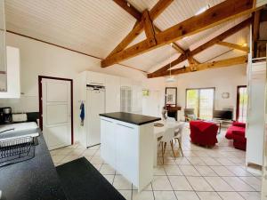 a kitchen and living room with a table and chairs at Villa Arcachon, 4 pièces, 6 personnes - FR-1-433-69 in Arcachon