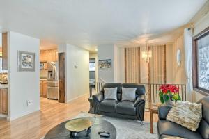 a living room with a couch and a table at West Anchorage Home Near Airport! home in Anchorage