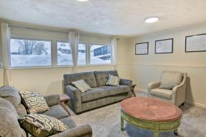 a living room with a couch and two chairs and a table at West Anchorage Home Near Airport! home in Anchorage