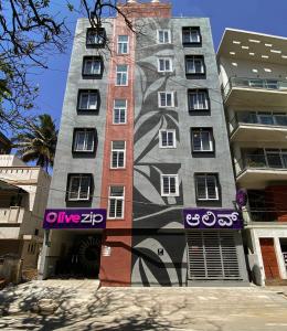 a building with a painting on the side of it at Olive Koramangala 4th Block by Embassy Group in Bangalore