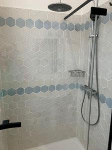 a bathroom with a shower with a glass door at LemonTree Terrace village centre in Cotignac +10 photos