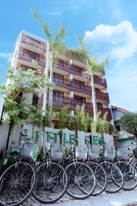 a row of bikes parked in front of a building at Little Gem. An Eco-Friendly Boutique Hotel & Spa in Hoi An