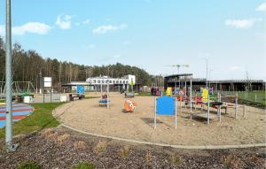 a playground in a park with playground equipment at Nice Home In Lidzbark Warminski With House A Panoramic View in Lidzbark Warmiński